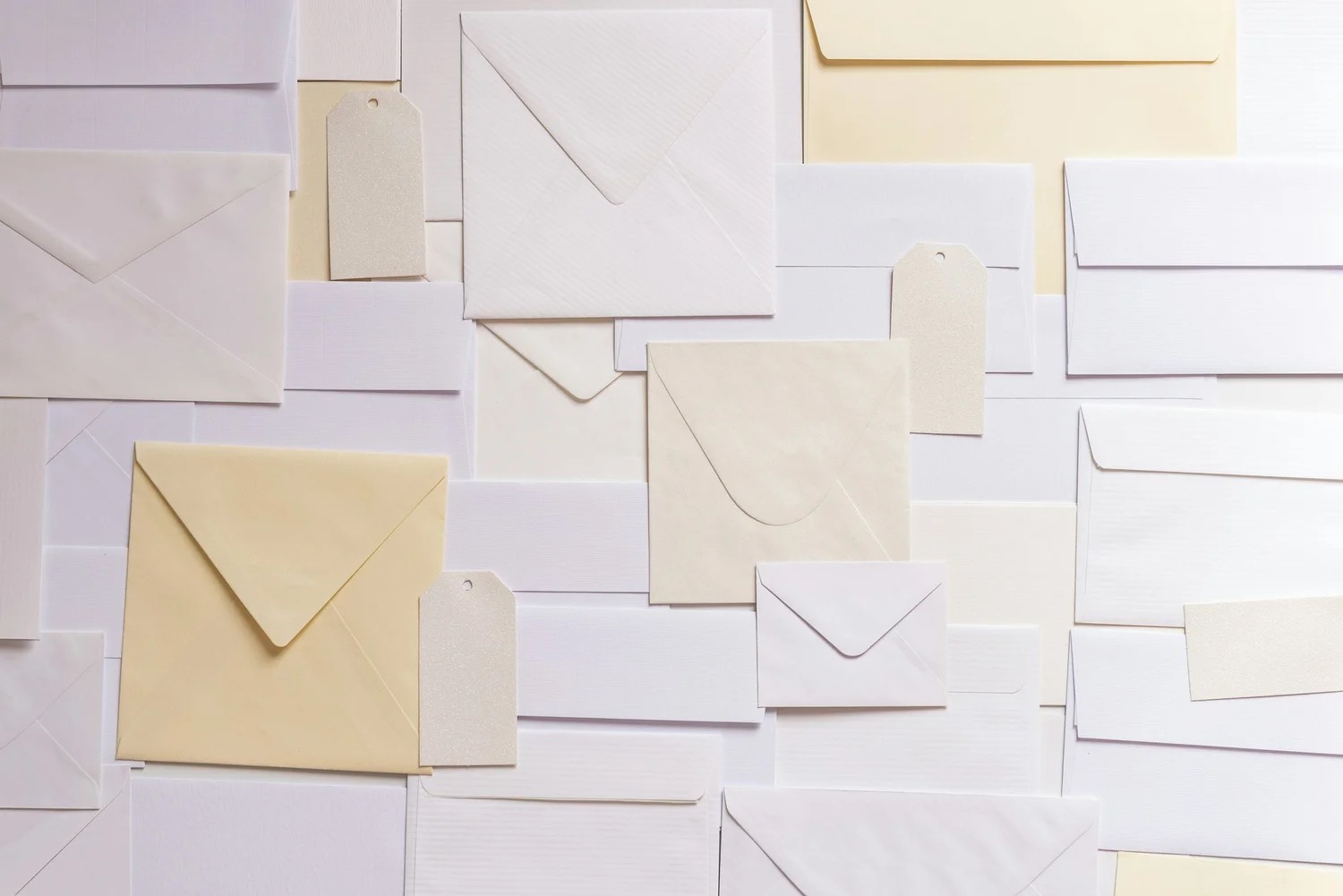 Printed envelopes and cards laid out in a grid