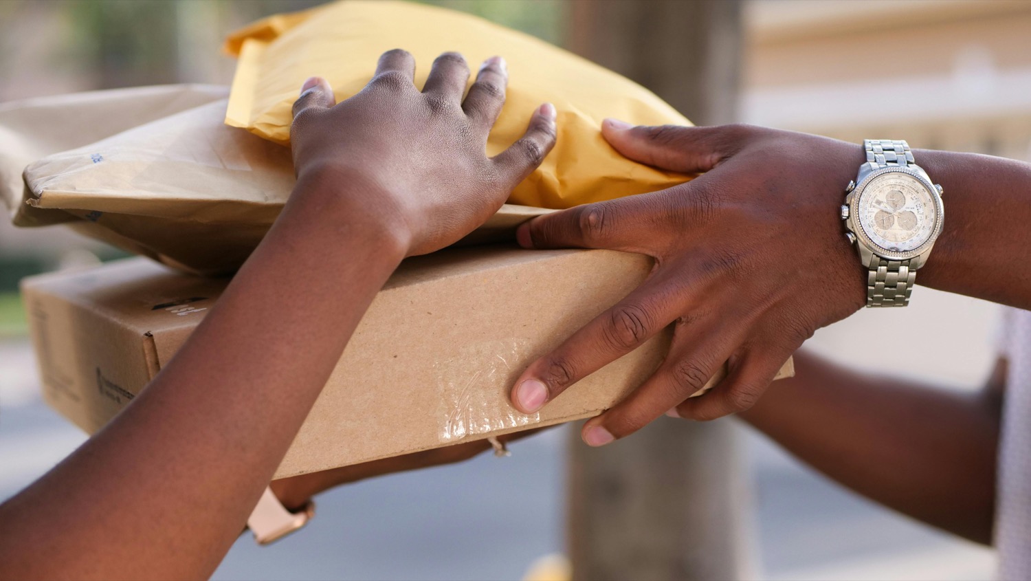 A parcel handed over on a doorstep