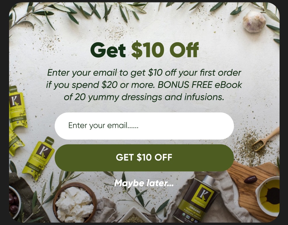 A Klaviyo sign-up form on the live Kasandrinos storefront, an email field and one button over a flat lay of olive oil, olives and feta